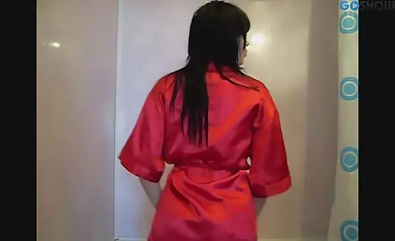 Brunette in a Red Bathrobe Splashes in the Shower
