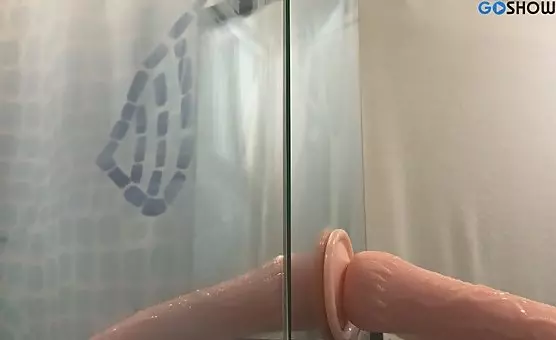 Hot Dildo Sucking Action Under Steamy Shower